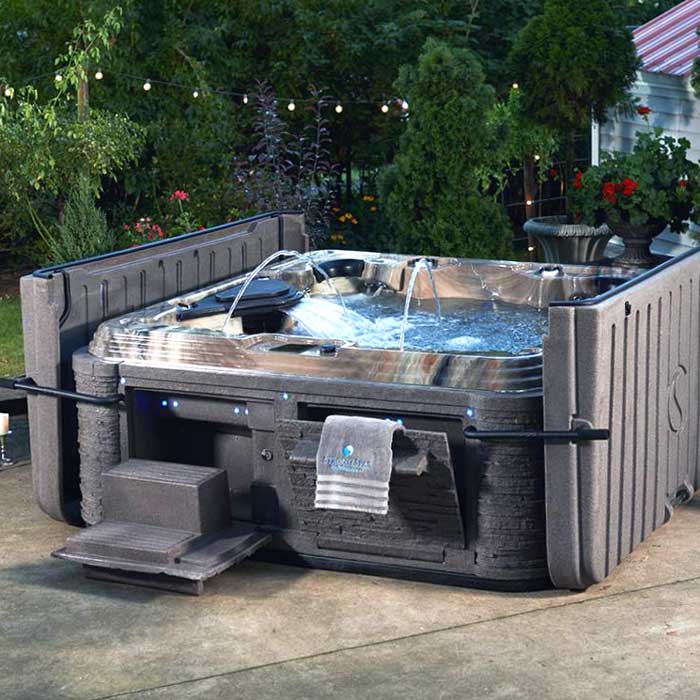 Professional Hot Tub Leak Detection & Repair Services Greater New Berlin WI A professional fixes a hot tub leak